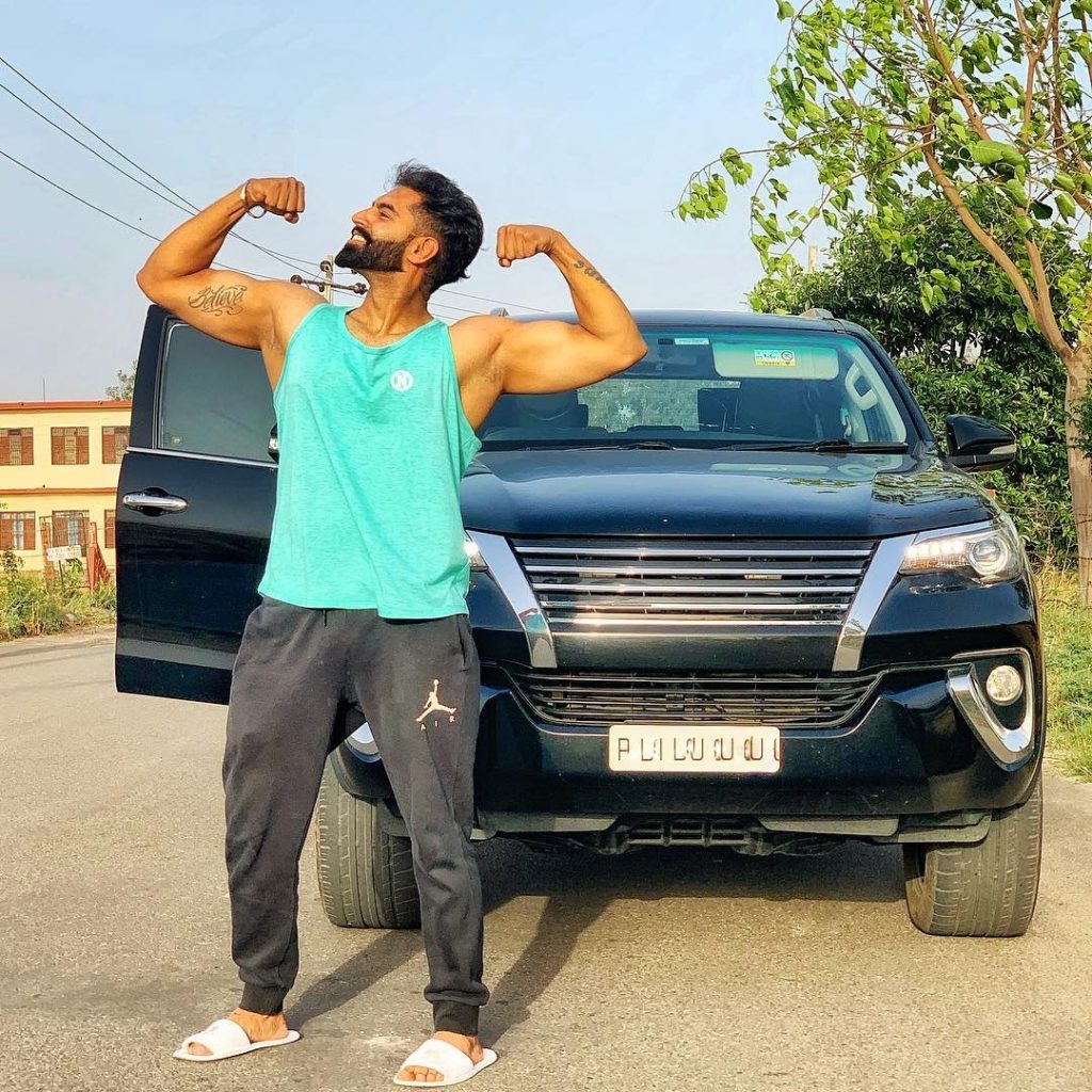 Parmish Verma with his car showing body wallpaper