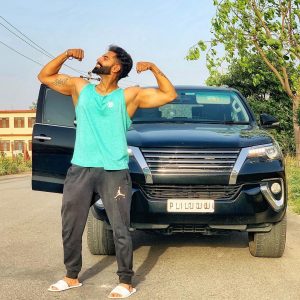 Parmish Verma with his car showing body wallpaper
